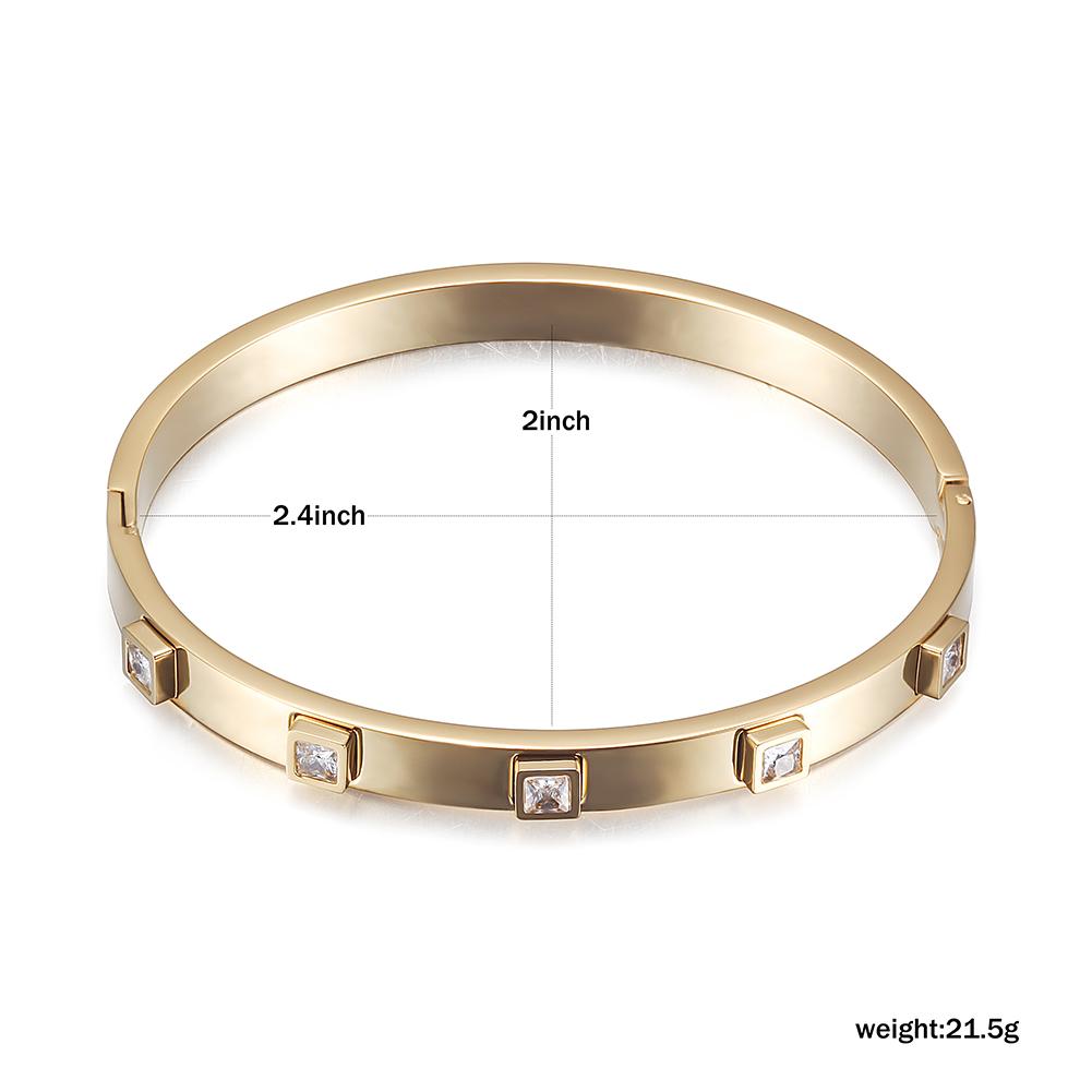 The Metal Stone Hinged Bangle is a sleek 14K gold PVD plated stainless steel bracelet, featuring square diamond accents evenly spaced along its hypoallergenic band.