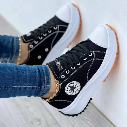 A woman wearing a pair of Flat Lace-Up Sneakers Pattern Canvas Shoes Casual Sport Shoes.