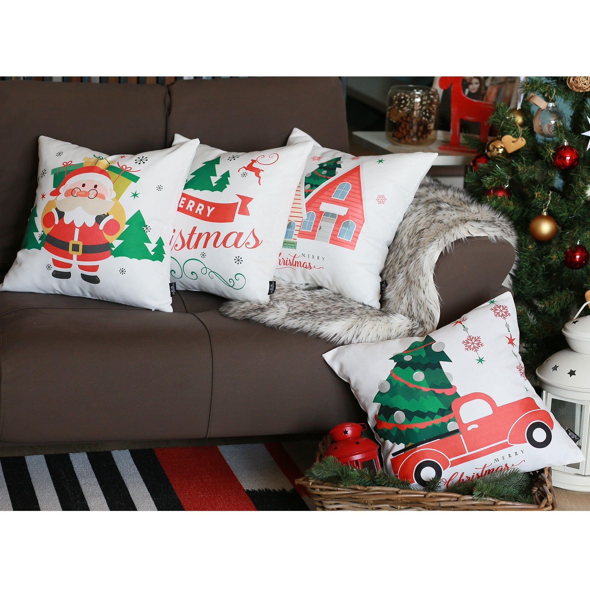 A set of four Christmas Themed Decorative Throw Pillows, square 18" x 18", and multi-colored, are arranged on a sofa near a decorated Christmas tree and a cozy rug.