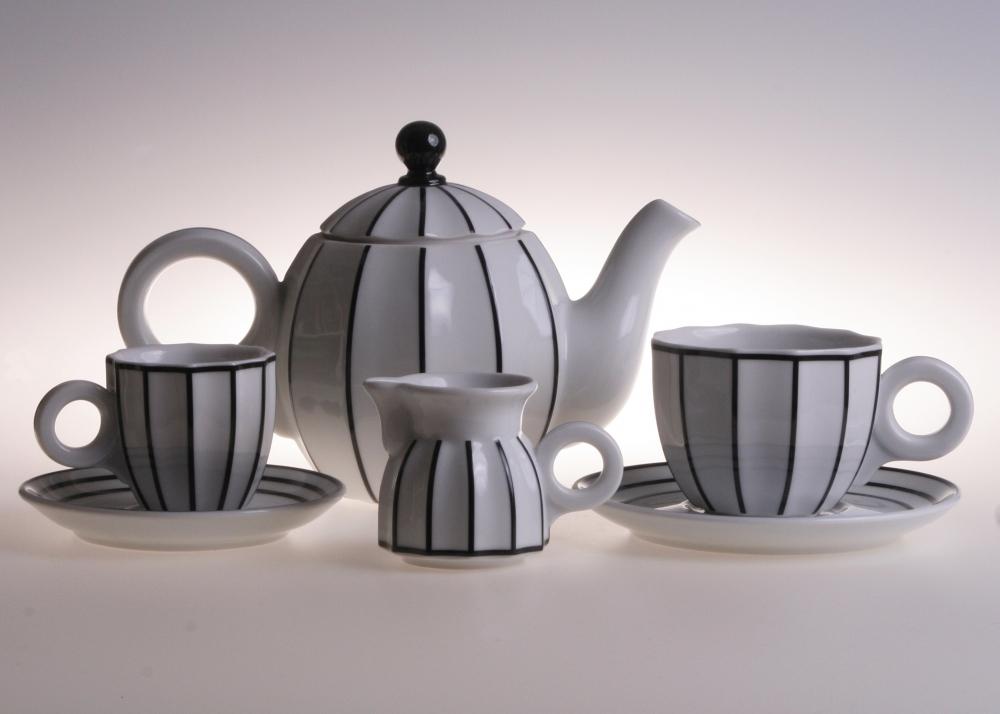 A Retro coffee/tea set by Pink Aether with a cup and saucer.
