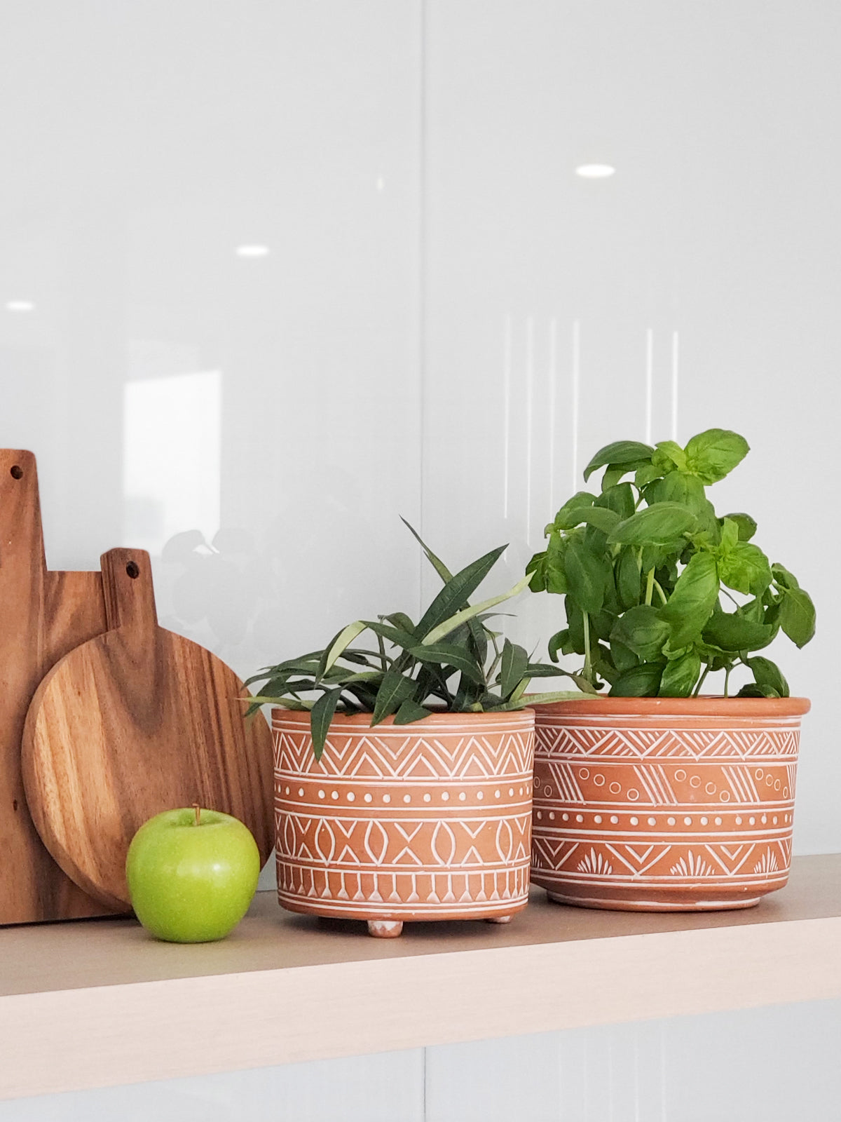 The Hand Etched Terracotta Pot - Large features a stunning artisan-inspired design, highlighted by intricate white geometric and floral patterns against a plain backdrop.