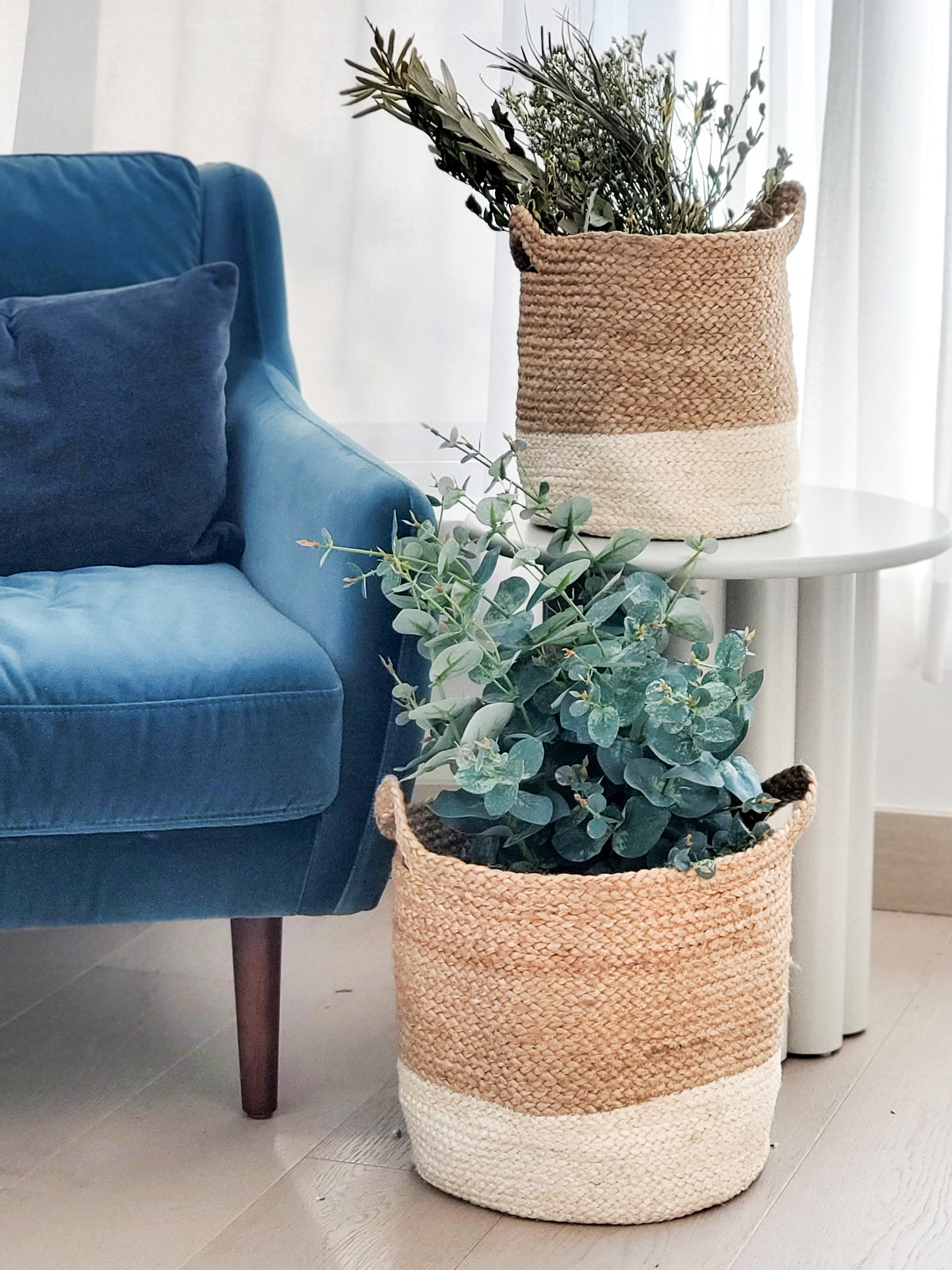 Two Kata Colorblock baskets with handles, featuring a two-tone design in natural and white fibers, crafted by Fair Trade artisans.