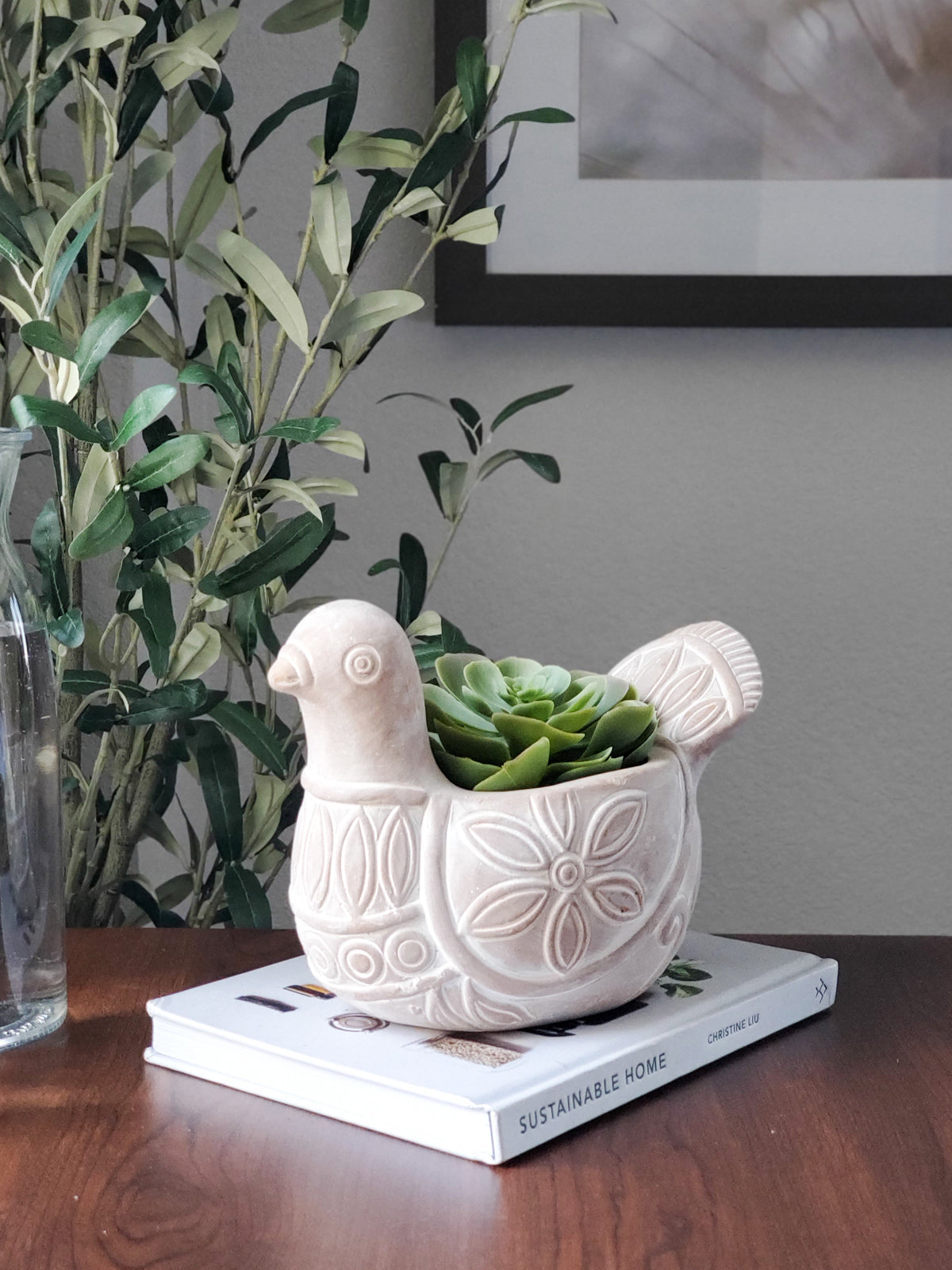 The Terracotta Pot - Spotted Dove is a whimsically crafted ceramic planter shaped like a bird, featuring detailed carved patterns on its body and tail. Made by Fair Trade artisans, it brings a delightful touch to any garden display.