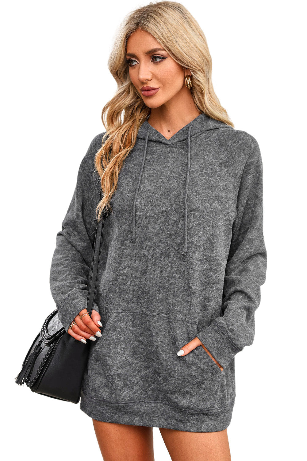 A person with blonde hair is standing with their back to the camera, wearing a Gray Mineral Wash Kangaroo Pocket Drawstring Pullover Hoodie.