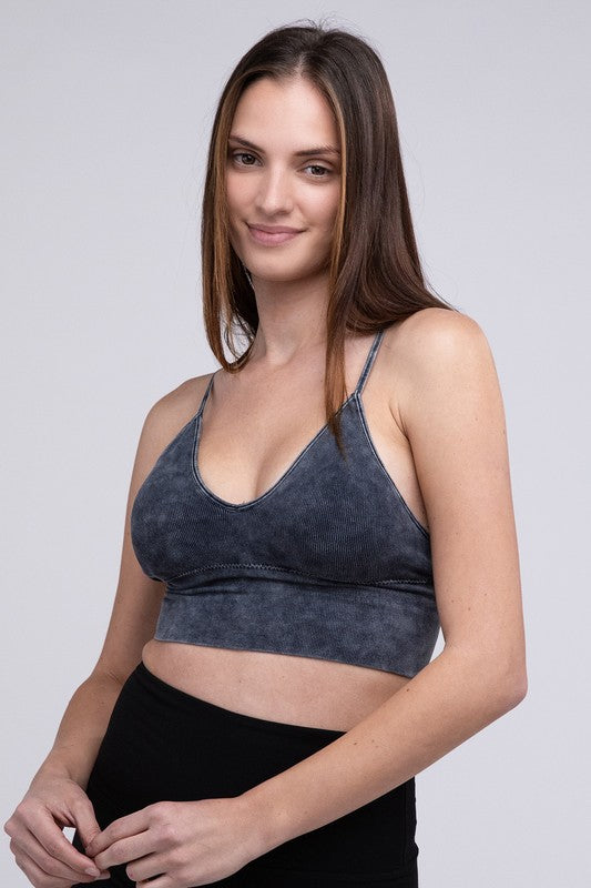 Woman in a Washed Ribbed Bra Padded Tank Top smiling at the camera, standing against a neutral background.