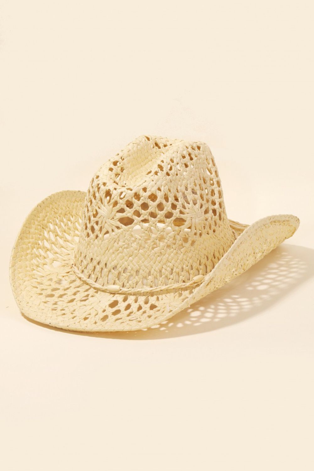 A wide-brimmed, light-colored Fame Straw Weave Rope Ribbon Cowboy Hat featuring intricate cutout designs.