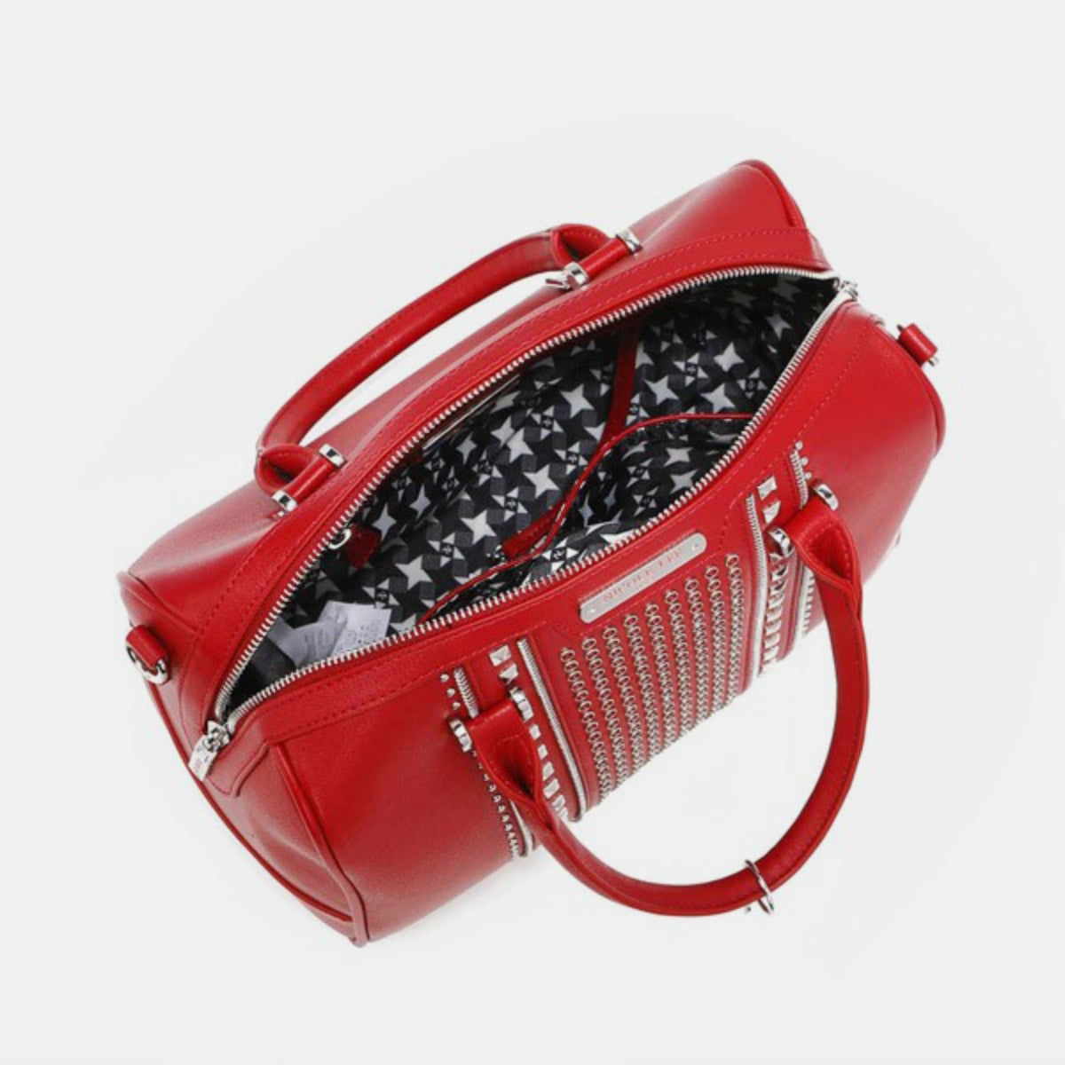 Nicole Lee USA Studded Boston Bag, crafted from luxurious vegan leather in red, showcases a design with two handles and metallic stud and ring embellishments on the front.