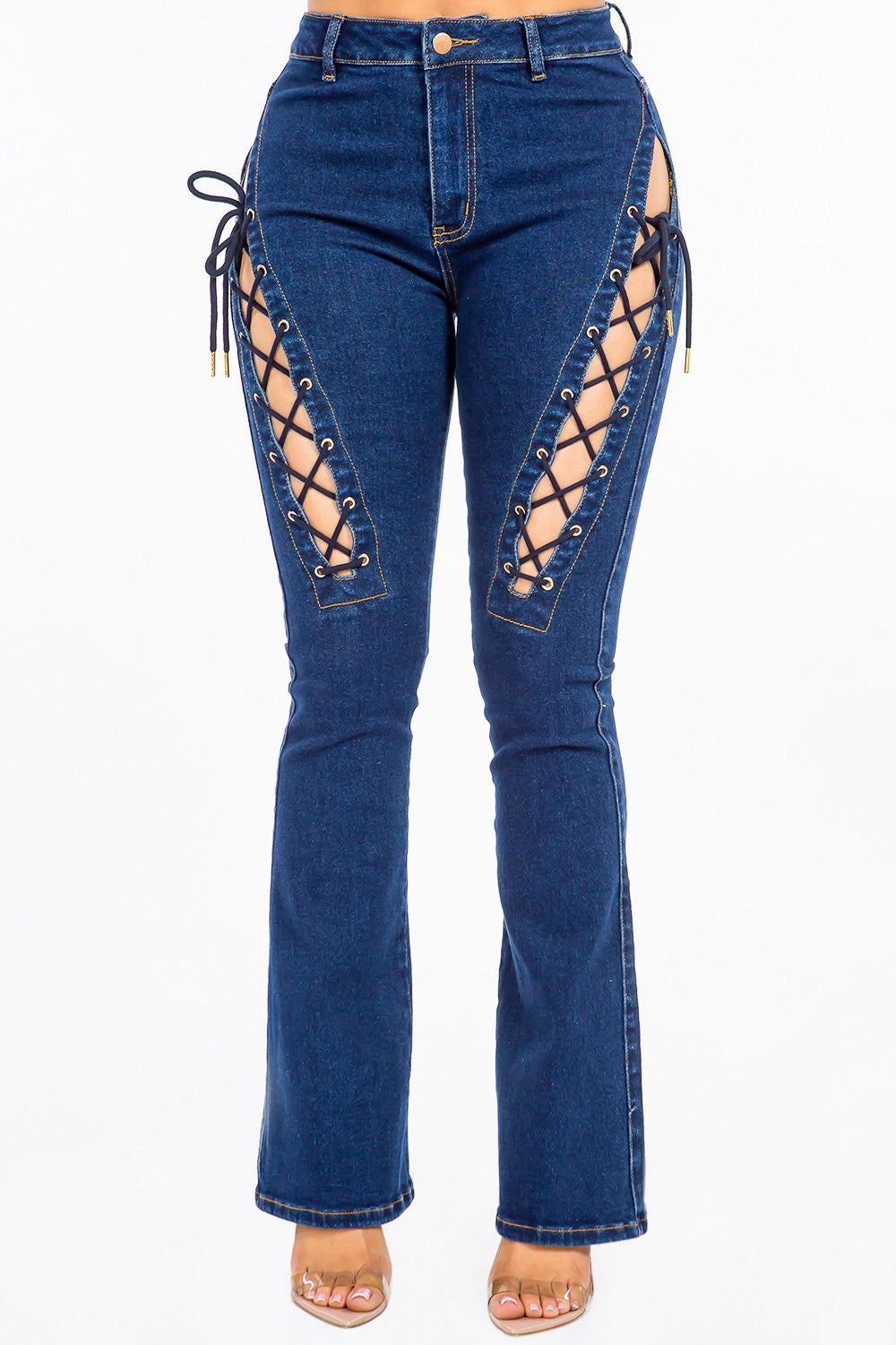 A pair of American Bazi High Rise Lace Up Jeans, featuring stylish denim and side detailing, worn by a person.