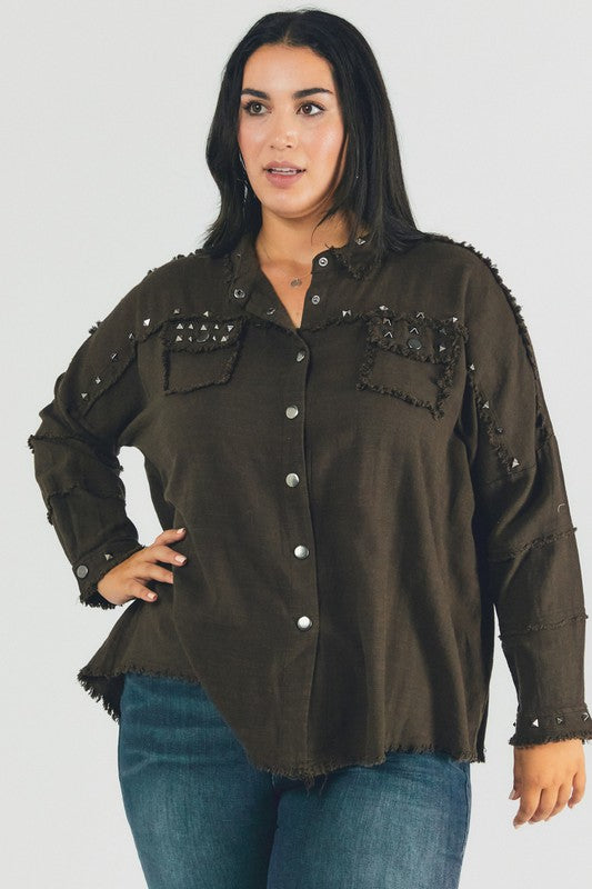 A person with dark hair wearing a Plus Distressed Hem Button Down Oversize Shirt and jeans stands against a light background, embodying casual comfort.