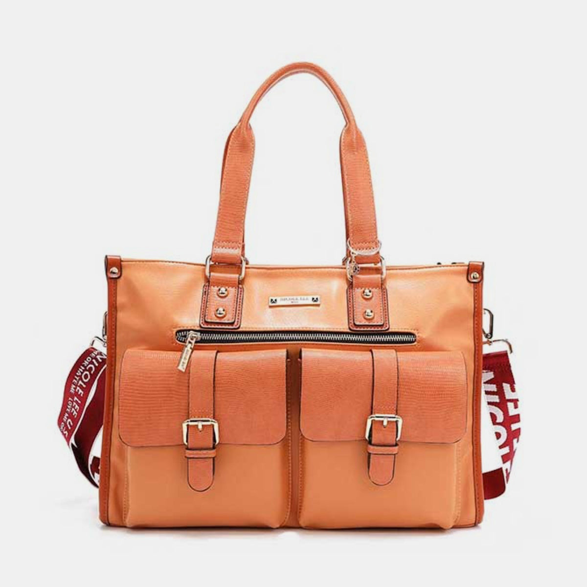 The Nicole Lee USA Large Messenger Bag, made from orange vegan leather, features two front pockets, gold buckles, a top zipper, and dual handles. Set against a white background, this stylish bag provides plenty of storage space for all your essentials.