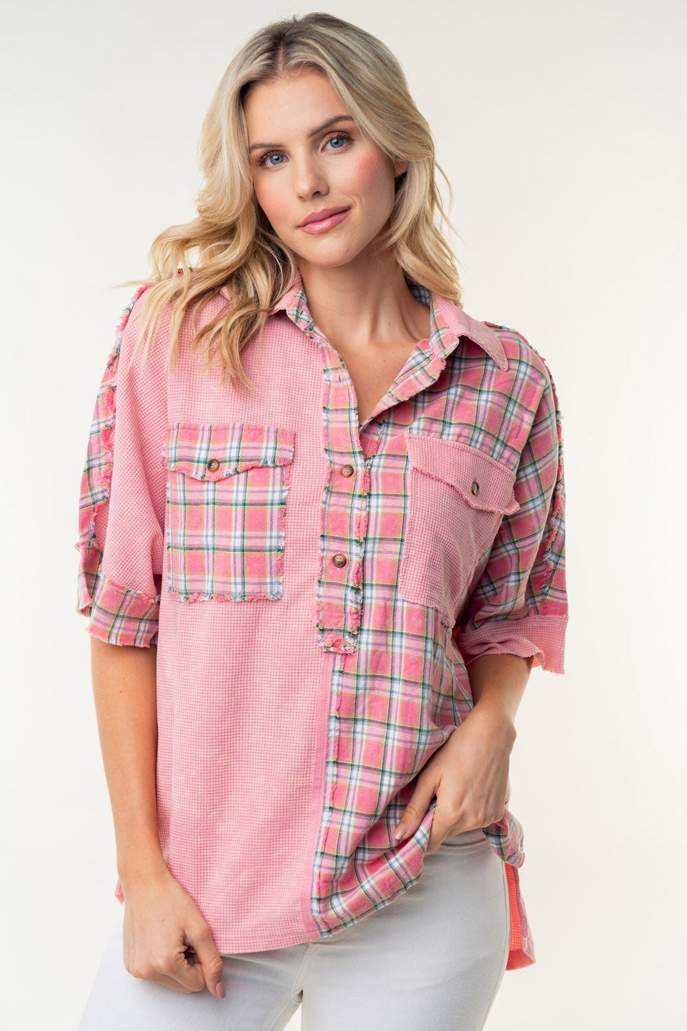 A person wearing the White Birch Plaid Color Block Half Button Top with white pants stands against a plain background.