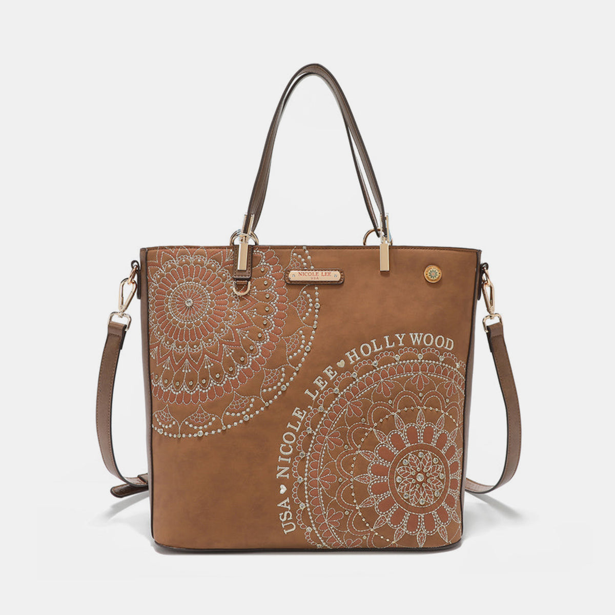 The Nicole Lee USA Metallic Stitching Embroidery Inlaid Rhinestone Tote Bag is a medium shopper in brown, crafted from vegan leather with intricate white mandala patterns and text that reads "USA Nicole Lee Hollywood." It features two shoulder straps, diamond rhinestones, and a decorative emblem on the front.