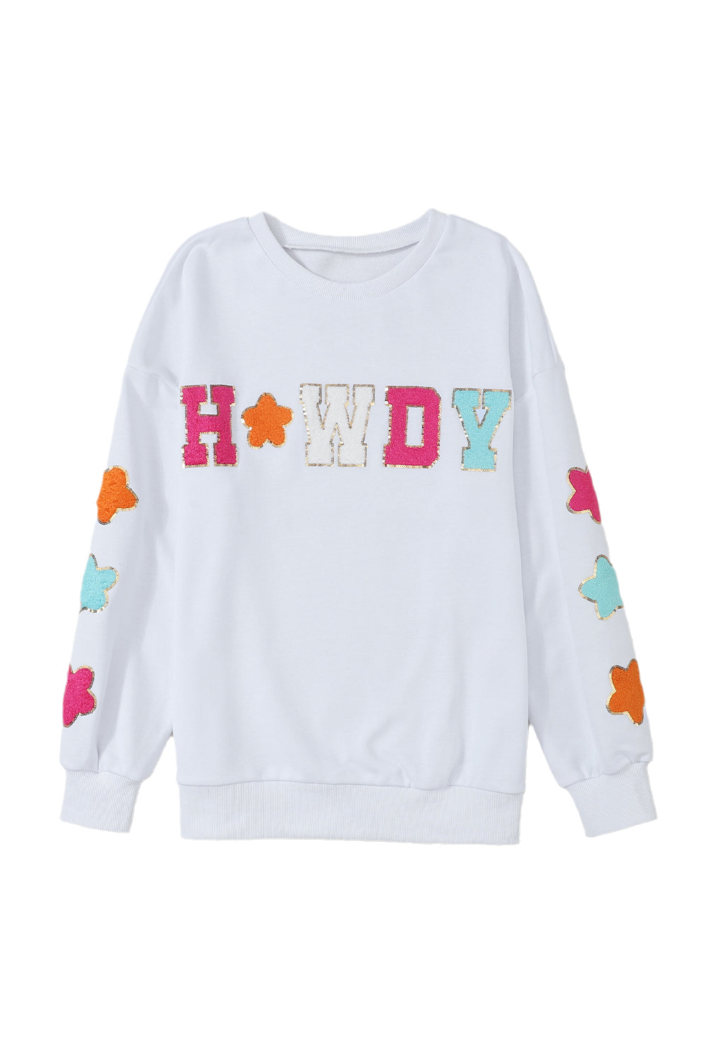 A person poses in the White Howdy Glitter Chenille Patch Graphic Casual Sweatshirt, adorned with colorful star patterns and the letters "WD." She wears light denim shorts and has shoulder-length blonde hair.