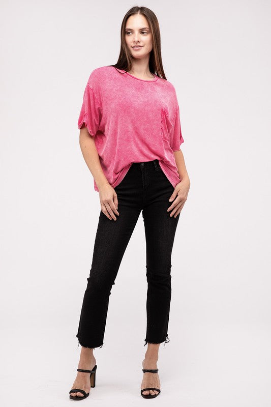 A person wearing a Washed Ribbed Cuffed Short Sleeve Round Neck Top in pink, paired with black pants, is standing against a plain background.