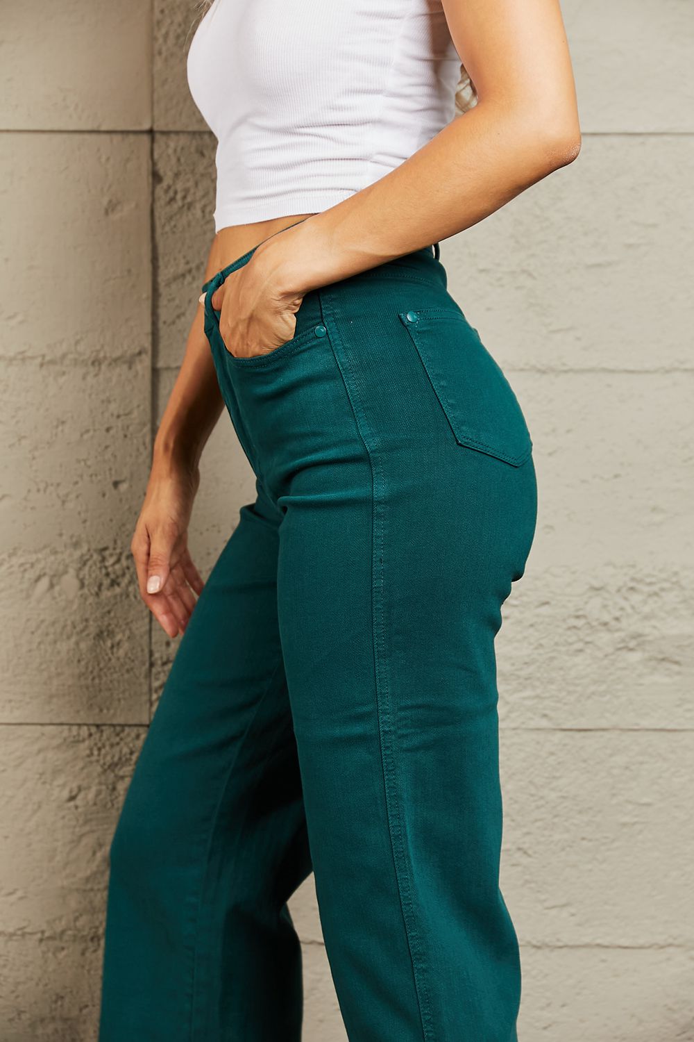 Person wearing Judy Blue Hailey Full Size Tummy Control High Waisted Cropped Wide Leg Jeans that offer subtle silhouette enhancement, paired with stylish white sandals.