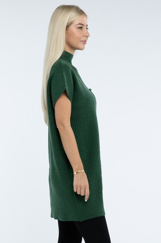 A woman stands wearing a brown Mock Neck Short Sleeve Sweater Dress with a pocket on the left side of the chest, paired with black ankle boots. She is posing against a plain white background.