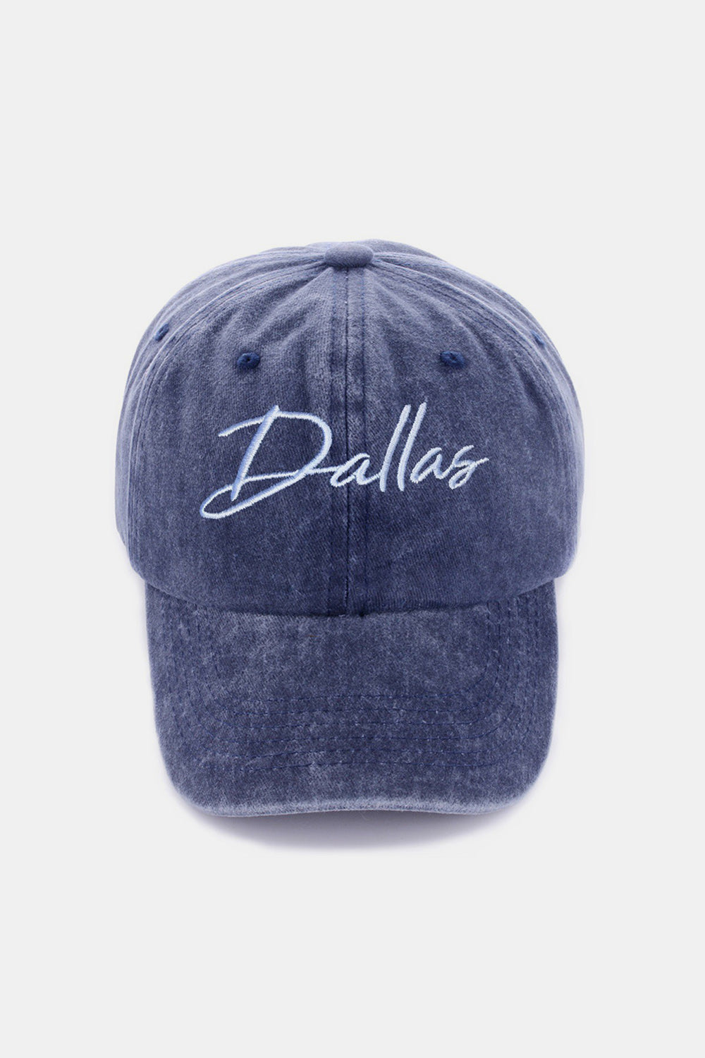 The Zenana Washed DALLAS Embroidered Baseball Cap is a black vintage-style cap featuring the word "Dallas" embroidered in white cursive font on the front, made from 100% cotton.