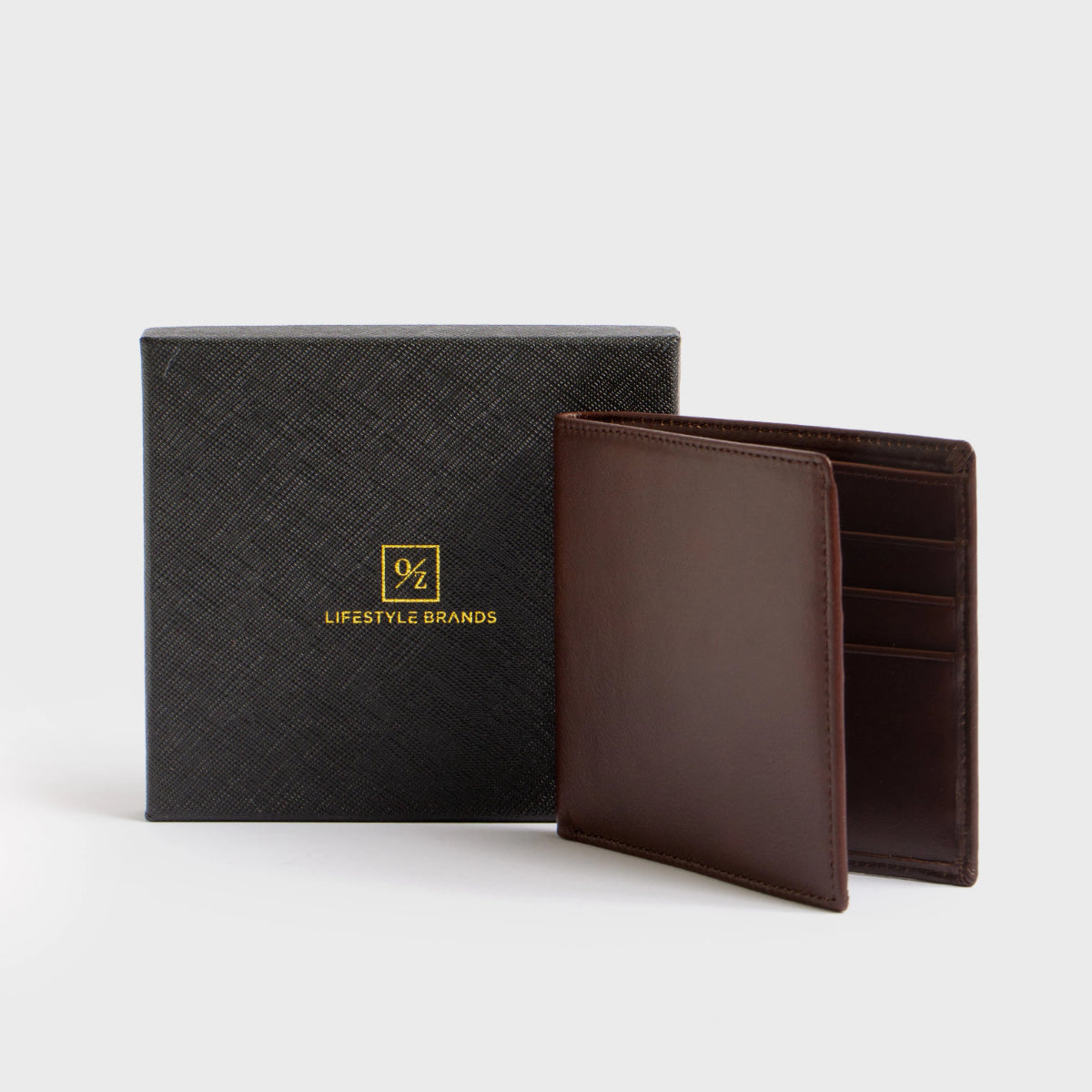 Close-up of the Lucca - Luxury Wallet, showcasing a contemporary design made from soft brown leather. It features a bi-fold layout with multiple card slots and is accented with a small, discreet gold logo in the corner.