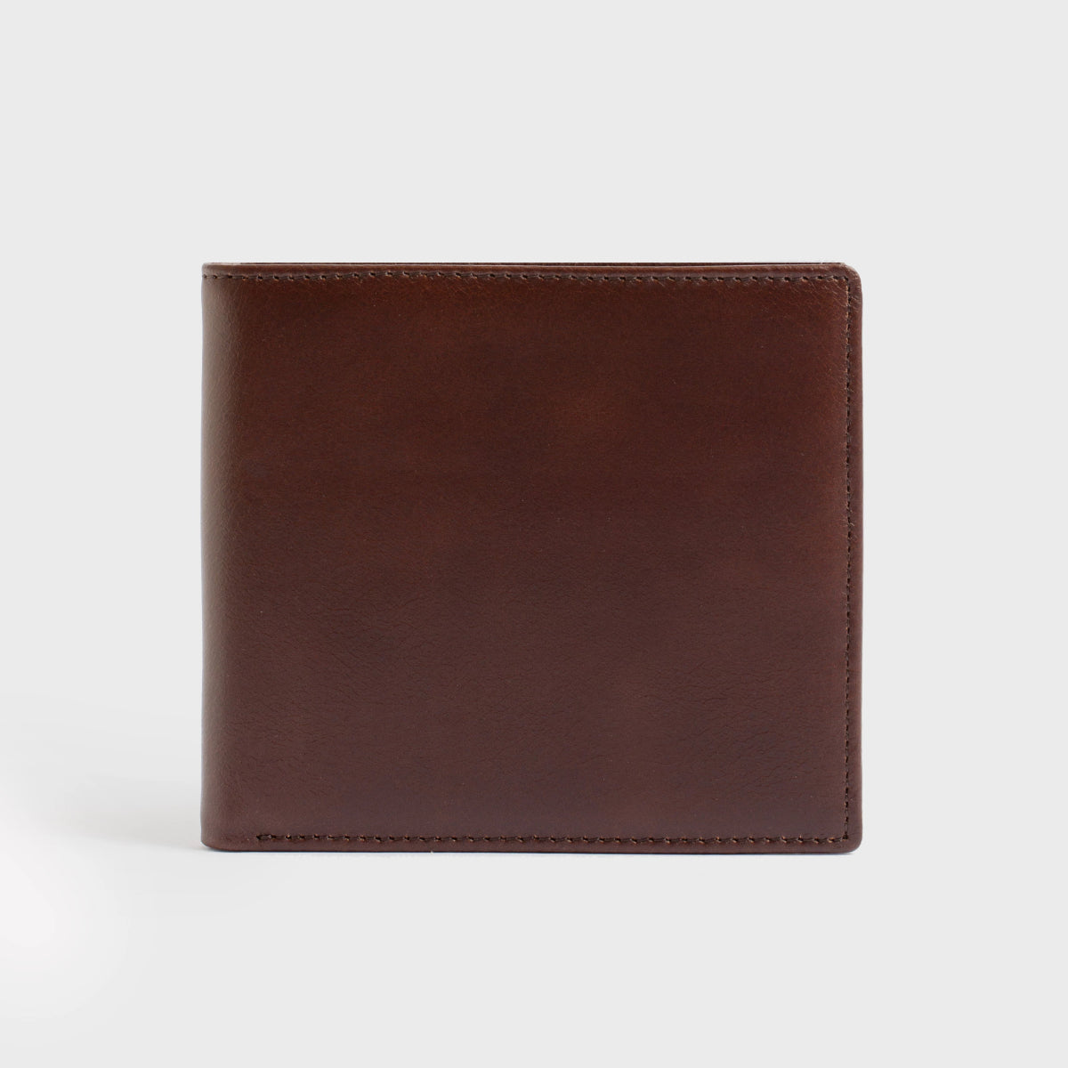 Close-up of the Lucca - Luxury Wallet, showcasing a contemporary design made from soft brown leather. It features a bi-fold layout with multiple card slots and is accented with a small, discreet gold logo in the corner.