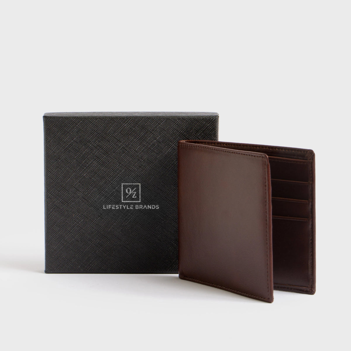 Close-up of the Lucca - Luxury Wallet, showcasing a contemporary design made from soft brown leather. It features a bi-fold layout with multiple card slots and is accented with a small, discreet gold logo in the corner.