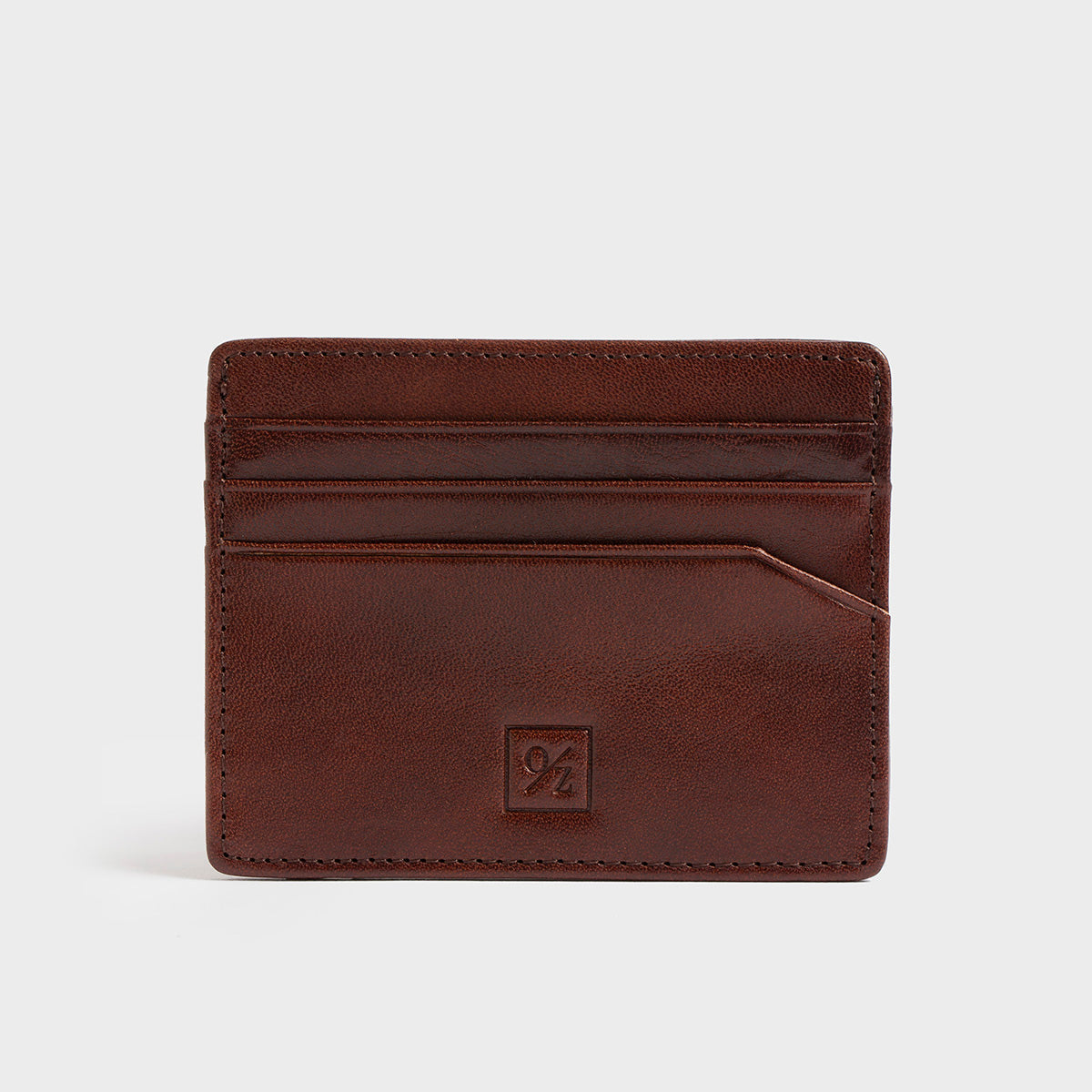 The Belforte - Slim Wallet is a stylish and lightweight black leather card-holder featuring an embossed logo, three card slots, and one easy-access side pocket. Displayed on a plain gray background, it combines elegance with functionality.