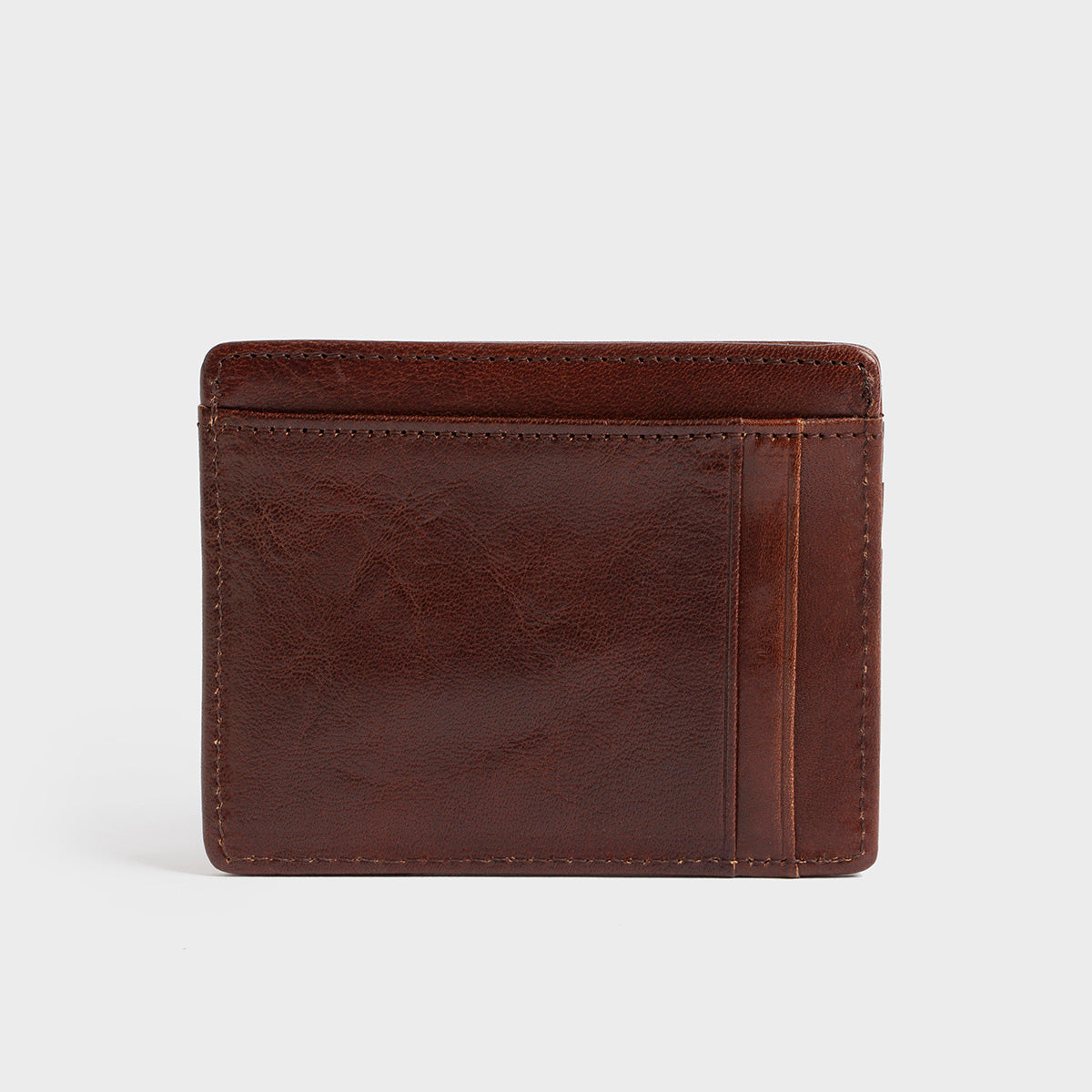 The Belforte - Slim Wallet is a stylish and lightweight black leather card-holder featuring an embossed logo, three card slots, and one easy-access side pocket. Displayed on a plain gray background, it combines elegance with functionality.