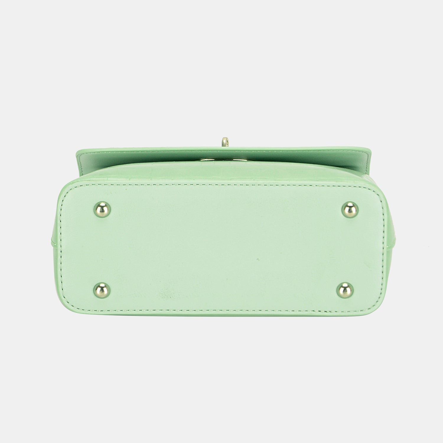 The David Jones Texture PU Leather Handbag is a small, stylish accessory featuring a crocodile texture in light green with textured PU leather. It includes a top handle and a silver clasp on the front flap, all set against a plain background.