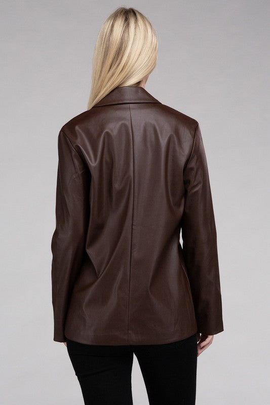 A person with long blonde hair wears the Sleek Pu Leather Blazer with Front Closure over a black top, standing against a plain background.