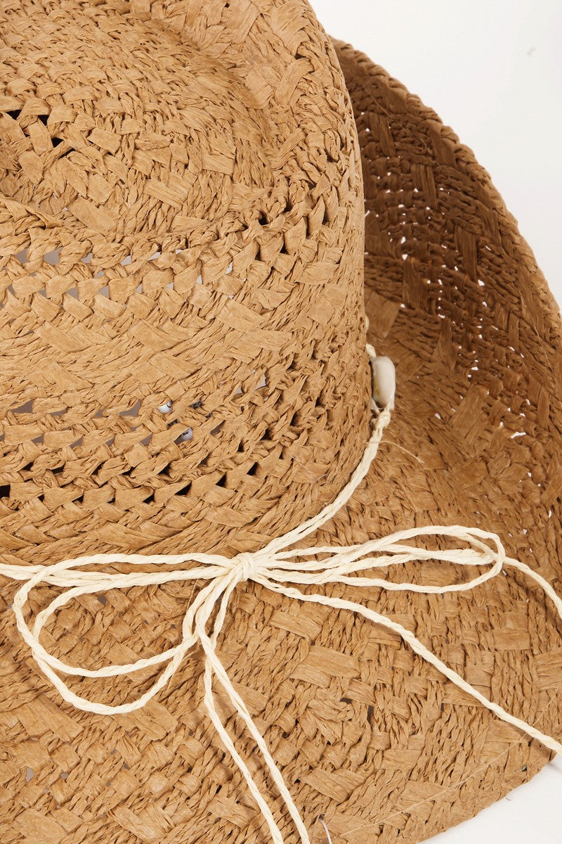 The Fame Openwork Shell Weave Straw Hat is a perfect summer accessory, featuring an intricate openwork design with a decorative band of small white seashells around the base of the crown.