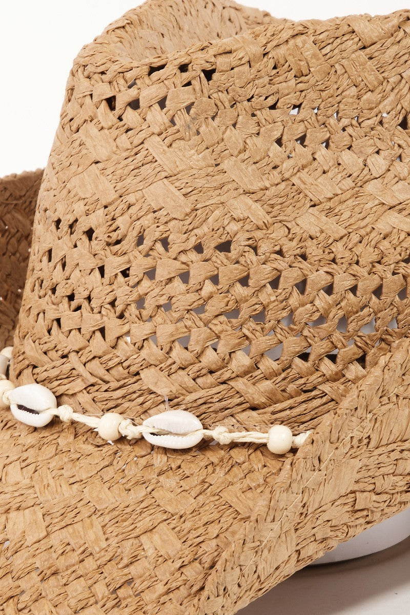 The Fame Openwork Shell Weave Straw Hat is a perfect summer accessory, featuring an intricate openwork design with a decorative band of small white seashells around the base of the crown.