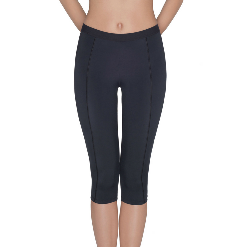 Person wearing dark-colored, form-fitting Capri Leggings Lauma Active Lady Fitness, perfect for average intensity workouts; shown from the waist down with legs and lower torso visible.