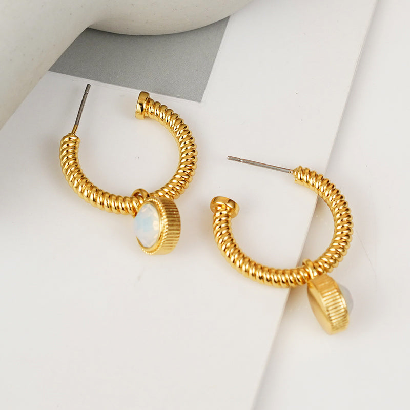 Introducing the Rope Cat's Eye Stone C-Hoop Earrings, featuring a gold-plated coiled design adorned with cat's eye gemstones near the clasps, set against a plain white background.