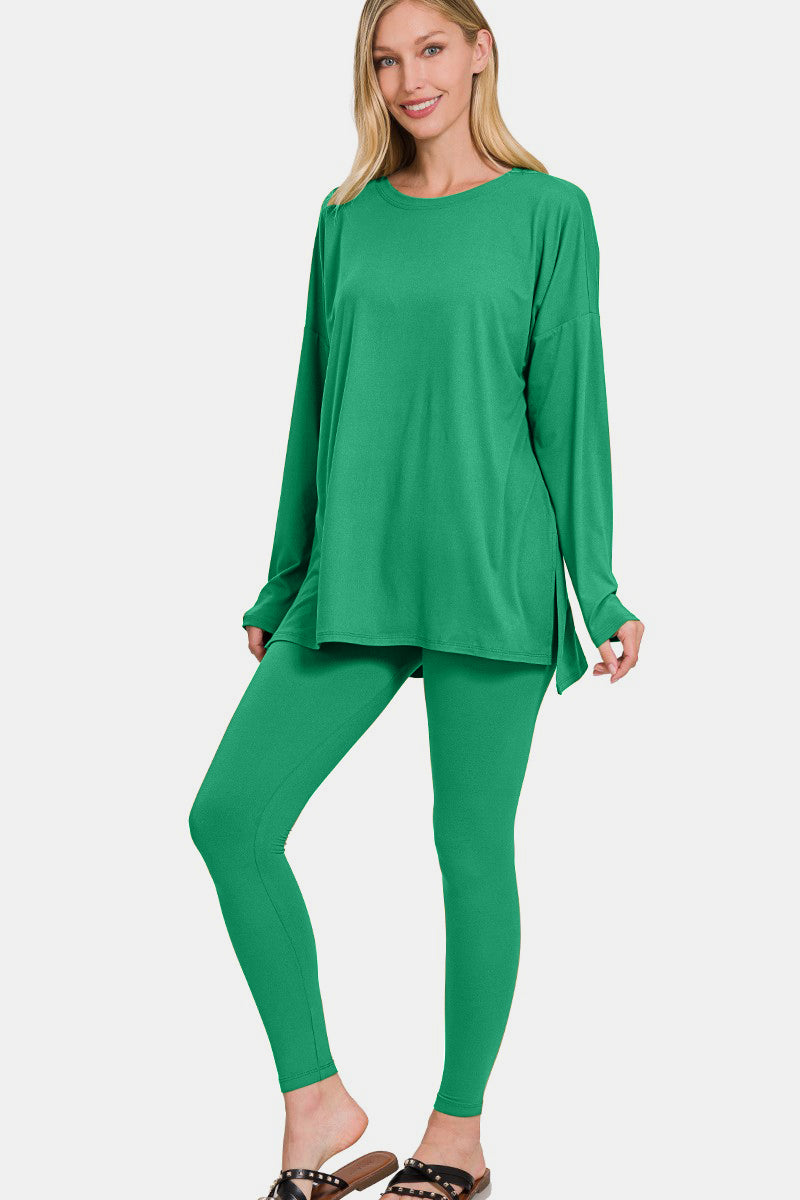 A person wearing the Zenana Full Size Brushed Microfiber Top and Leggings Lounge Set in bright green stands with one hand on their hip.