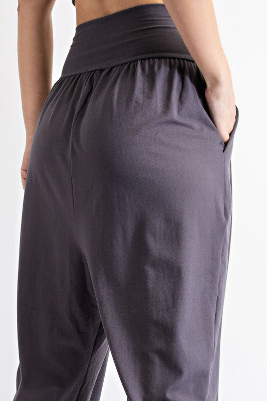 A person wearing black Butter Jogger With Side Pockets and white sneakers.