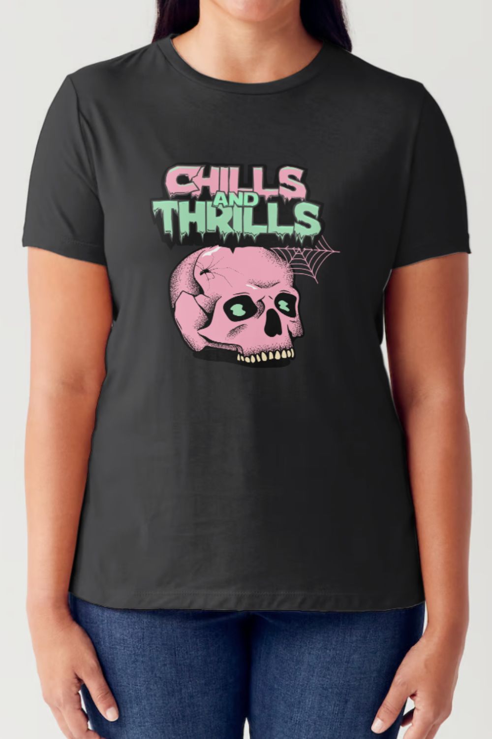 Person wearing the Simply Love Full Size CHILLS AND THRILLS Short Sleeve Tubular T-Shirt in black, featuring a pink skull design and the text "Chills and Thrills" in green and pink letters, perfect for your festive wardrobe.