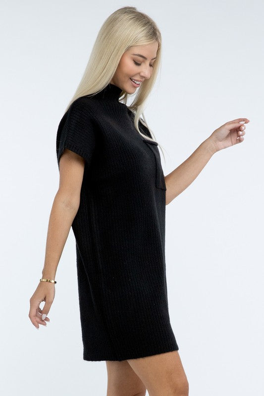 A woman stands wearing a brown Mock Neck Short Sleeve Sweater Dress with a pocket on the left side of the chest, paired with black ankle boots. She is posing against a plain white background.