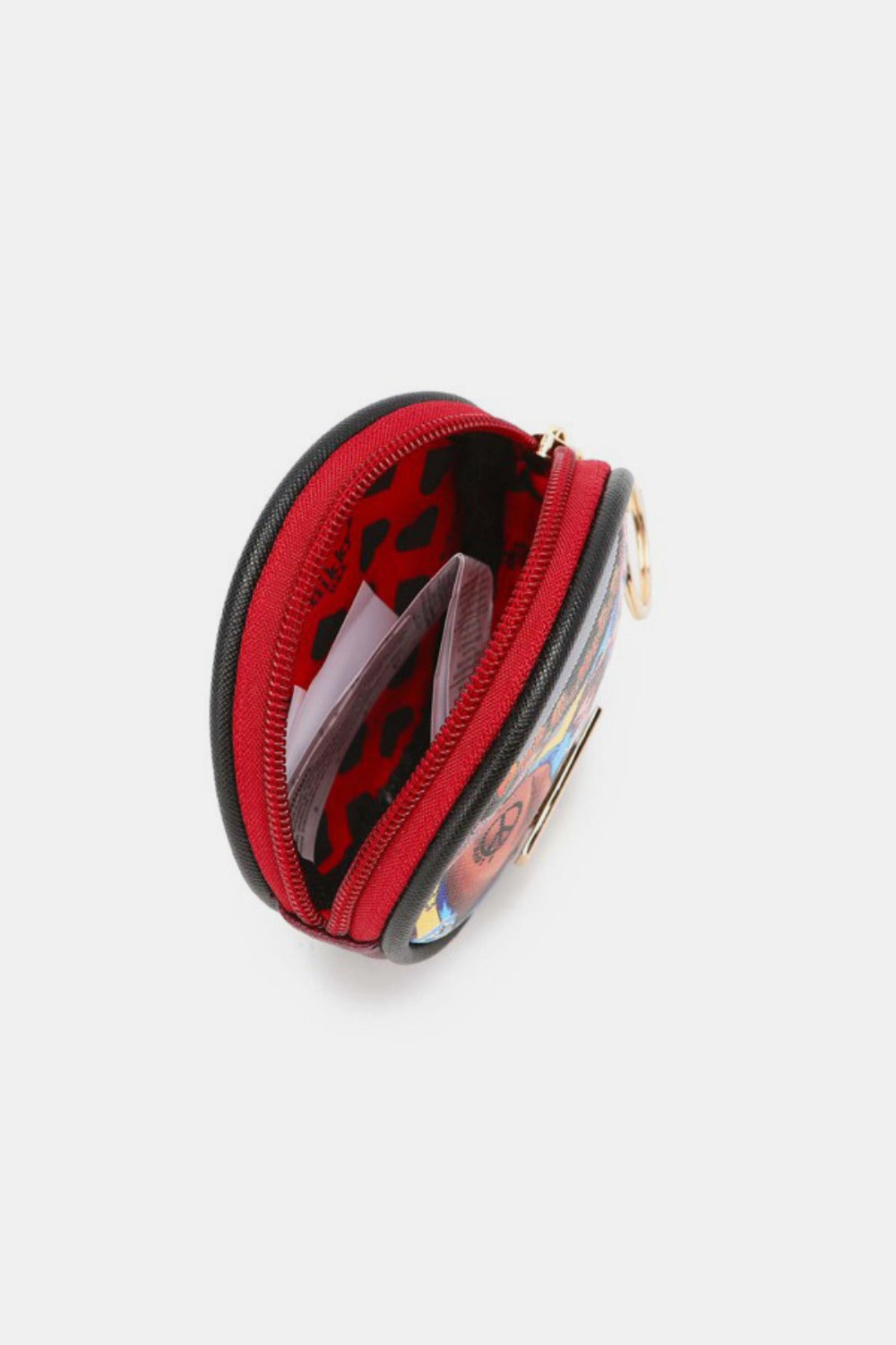 The Nicole Lee USA Keychain Round Coin Purse features a vibrant cartoon graphic on the front with three animated characters, crafted from eco-leather material. This stylish and functional accessory includes a zipper closure and a keyring attachment, making it perfect as a keychain round coin purse.