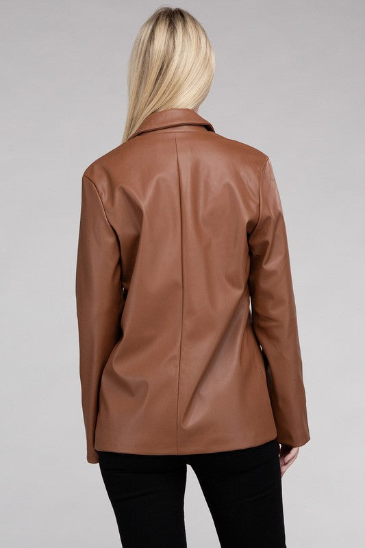 A person with long blonde hair wears the Sleek Pu Leather Blazer with Front Closure over a black top, standing against a plain background.