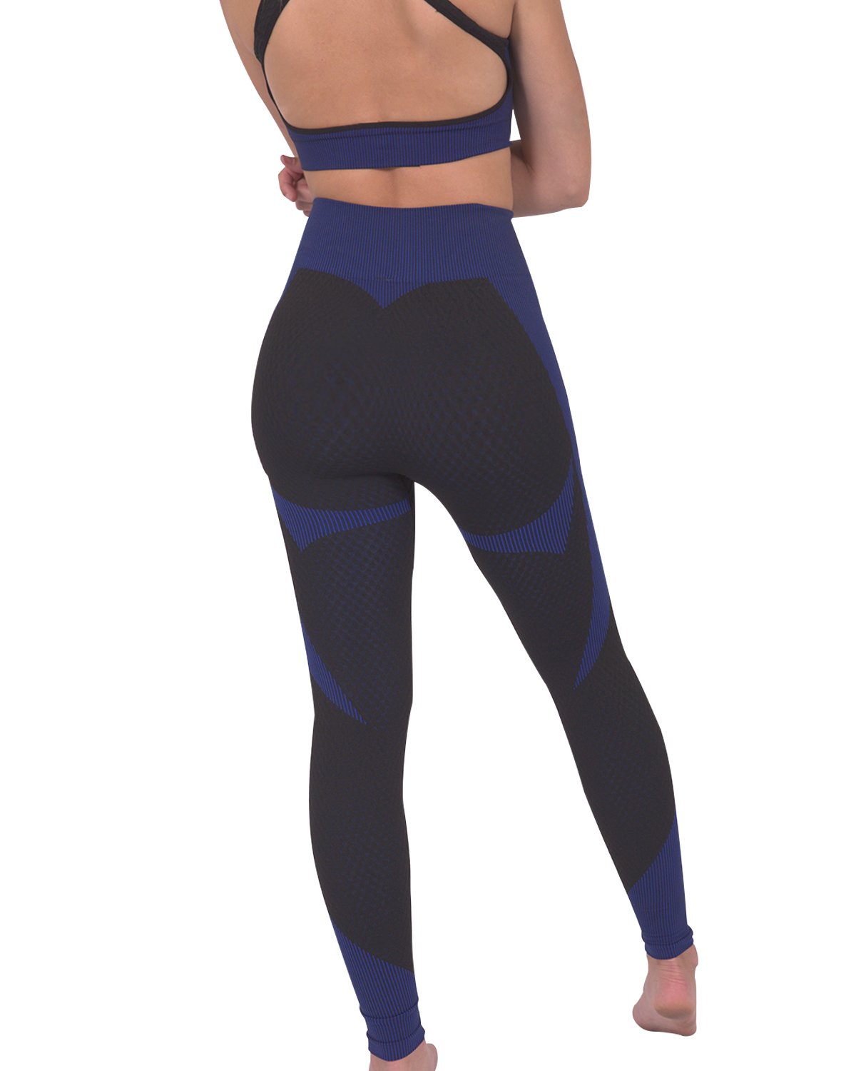 Person in a workout outfit showcasing the back view of Trois Seamless Legging - Black with Navy and a matching sports bra against a white background, highlighting the high-compression bodycon fabric.