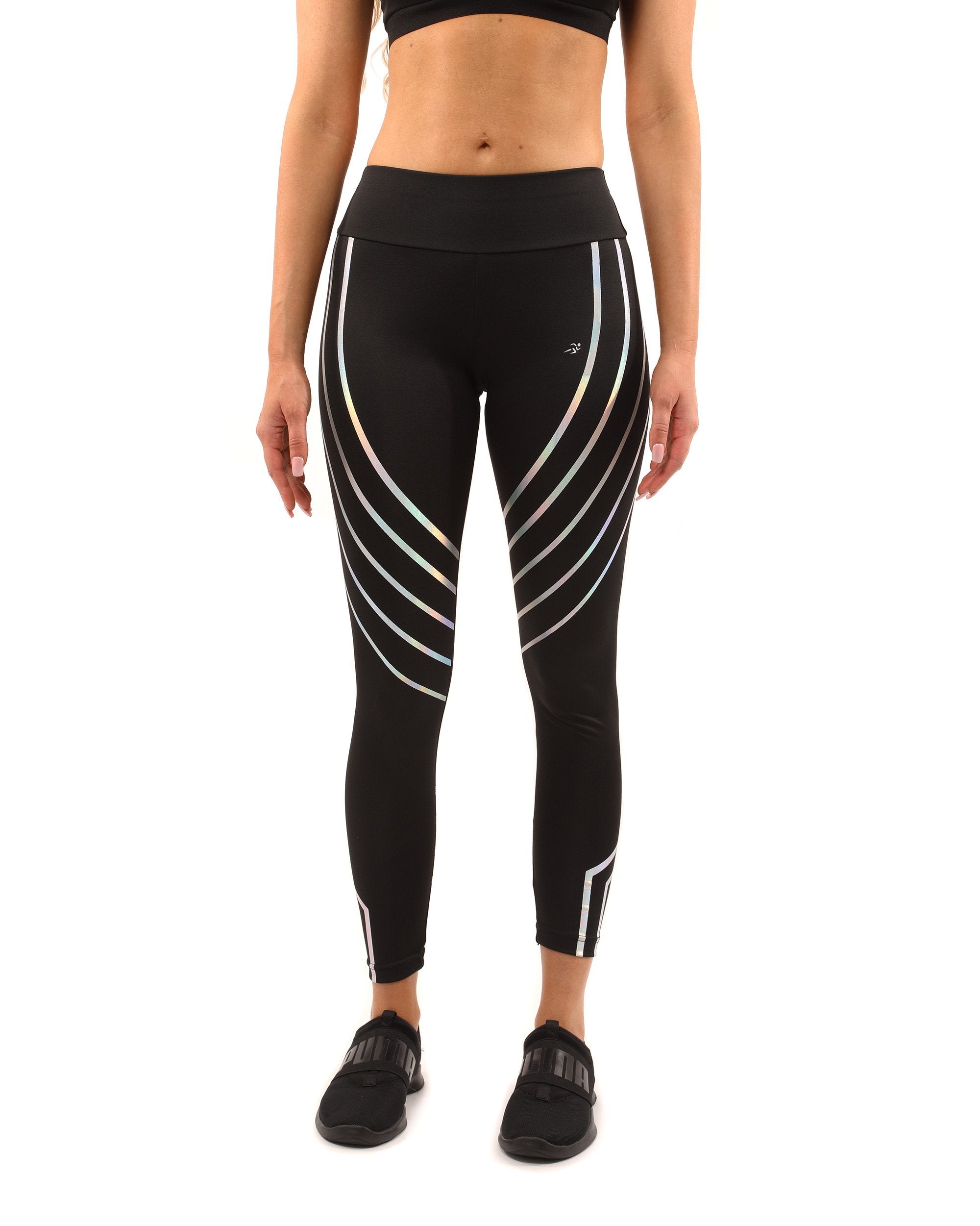 A person wears the sleek Laguna Set in black, featuring a sports bra with a mesh design and compression fit leggings, against a plain white background.