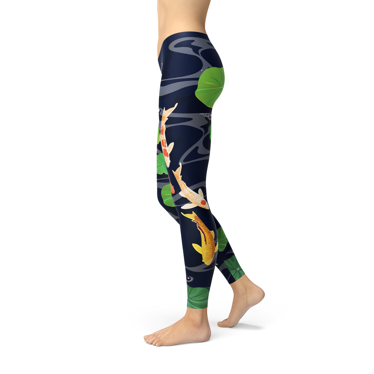 A person is modeling the Womens Koi Fish in Pond Leggings, which feature a koi fish and lily pad pattern on a dark background, crafted from smooth microfiber yarn with four-way stretch for ultimate comfort and flexibility.