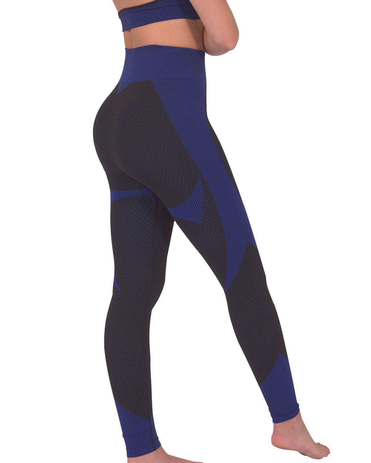 Person in a workout outfit showcasing the back view of Trois Seamless Legging - Black with Navy and a matching sports bra against a white background, highlighting the high-compression bodycon fabric.