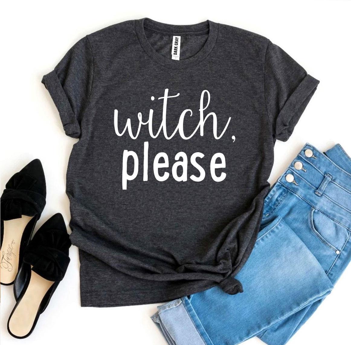 A Witch Please T-shirt in gray, celebrated for its soft texture and comfortable retail fit, is beautifully laid out next to a pair of blue jeans, beige high heels, and a bouquet of flowers.