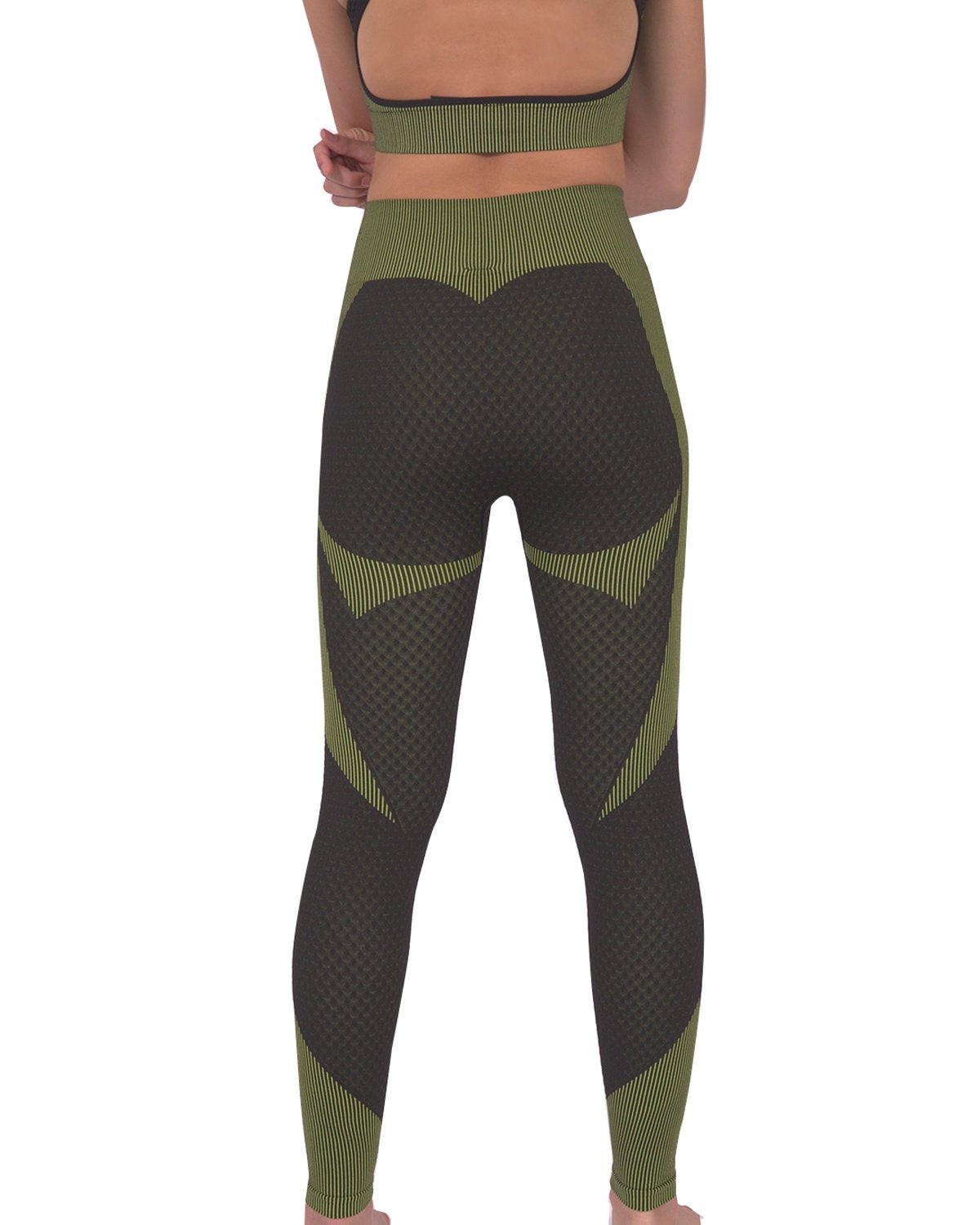 A person is dressed in a green and black athletic outfit, featuring the Trois Two Set. This set includes a sleeveless top paired with high-waisted Trois Seamless Legging - Black with Green, made from high-compression bodycon fabric with a textured pattern. The person's face is not visible in the image.