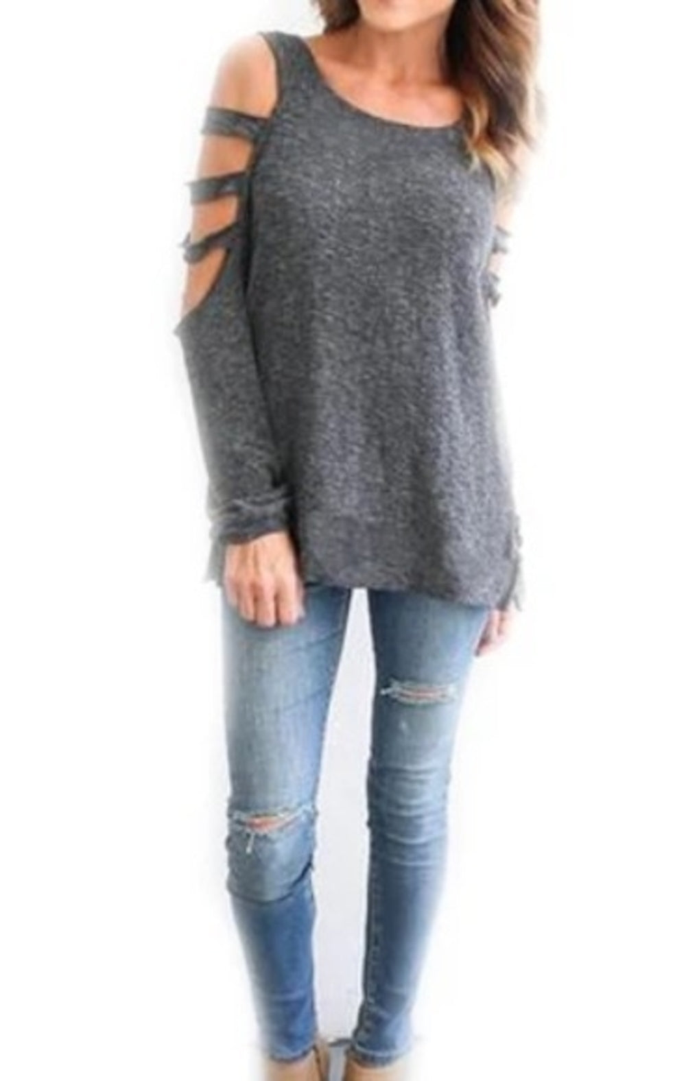 A woman rocking a trendy white Womens Open Shoulder Long Sleeve Casual Top and jeans for her street style look.