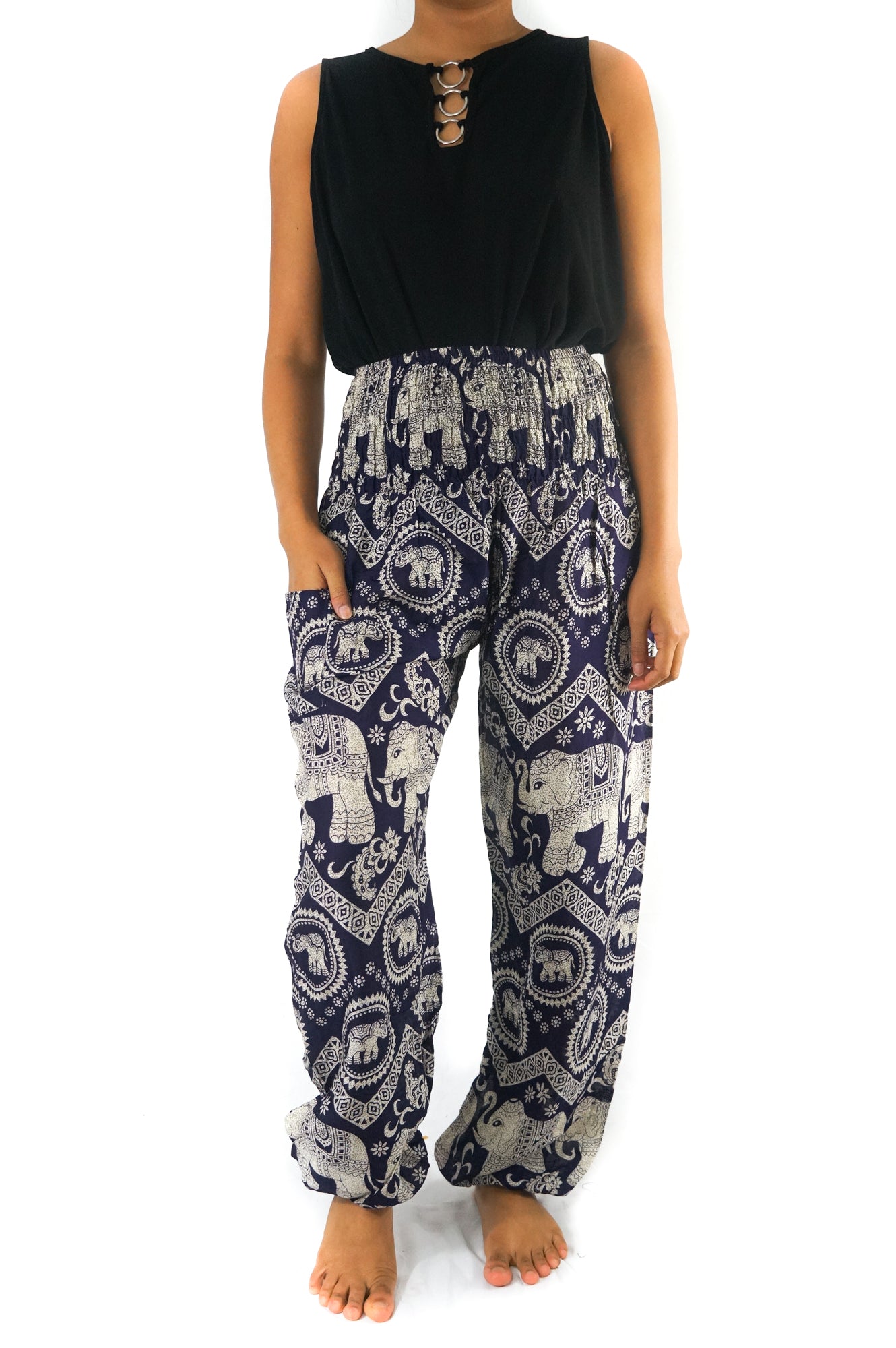 Two views of a person wearing the Purple ELEPHANT Pants: Women Boho Pants Hippie Pants Yoga, showcasing the intricate purple and white elephant patterns. Front and back views are provided to highlight the elastic waist and 100% rayon fabric.