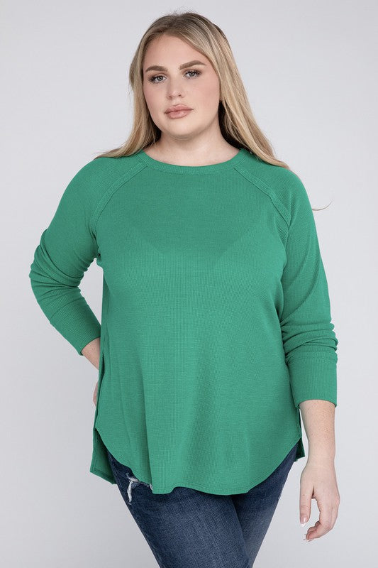 A woman in a Plus Melange Baby Waffle Long Sleeve Top and jeans posing with her hand on her hip, smiling.