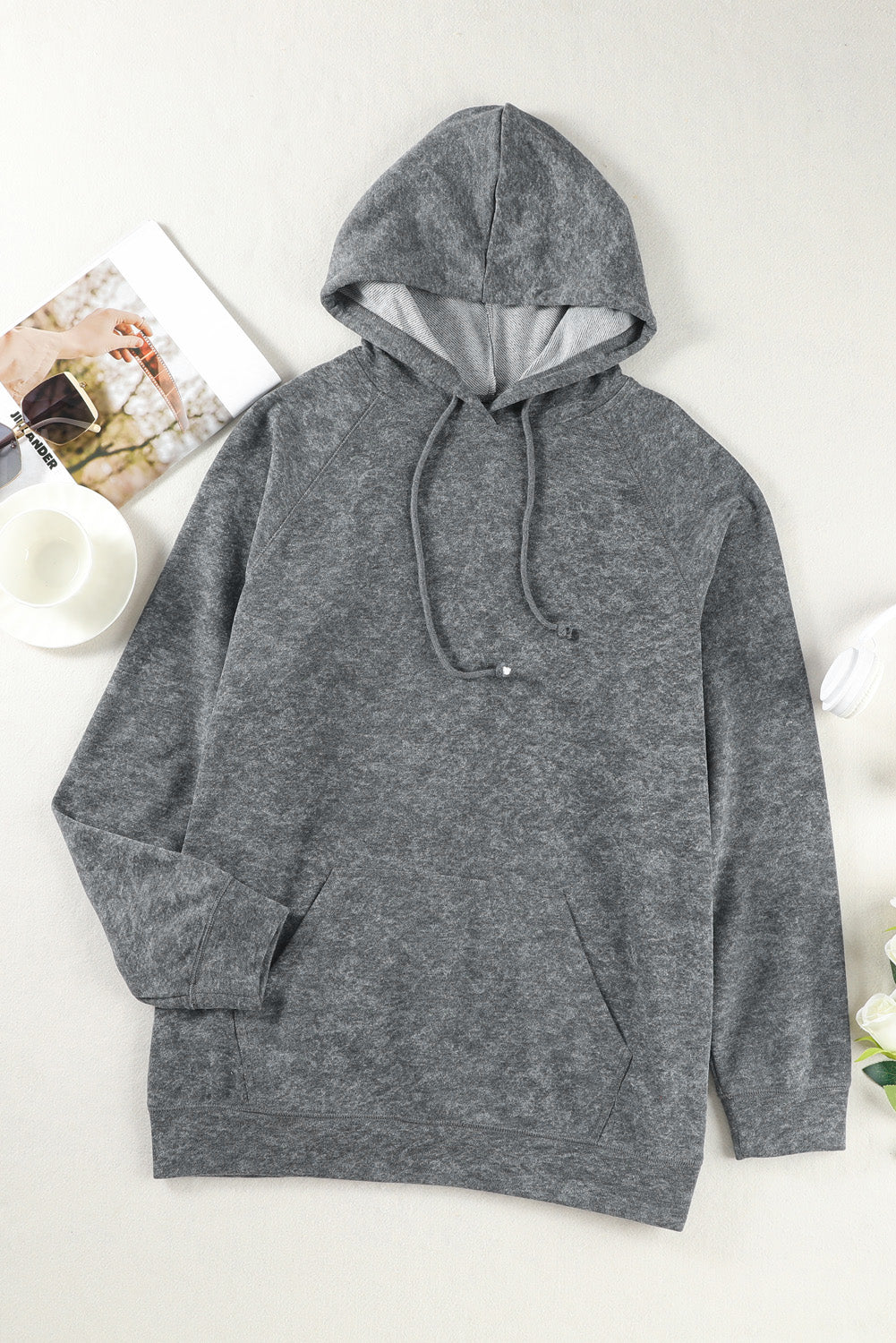 A person with blonde hair is standing with their back to the camera, wearing a Gray Mineral Wash Kangaroo Pocket Drawstring Pullover Hoodie.