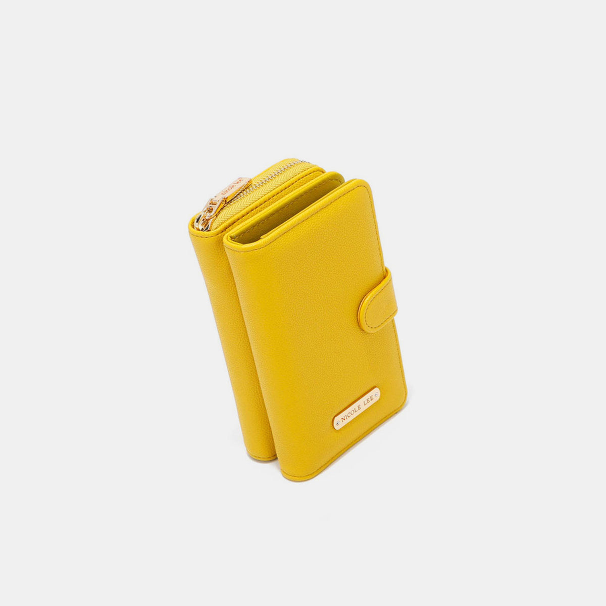 A yellow Nicole Lee USA 2 Piece Phone Case Crossbody Wallet, crafted from vegan leather, with a detachable strap and a snap button closure, displayed against a white background.