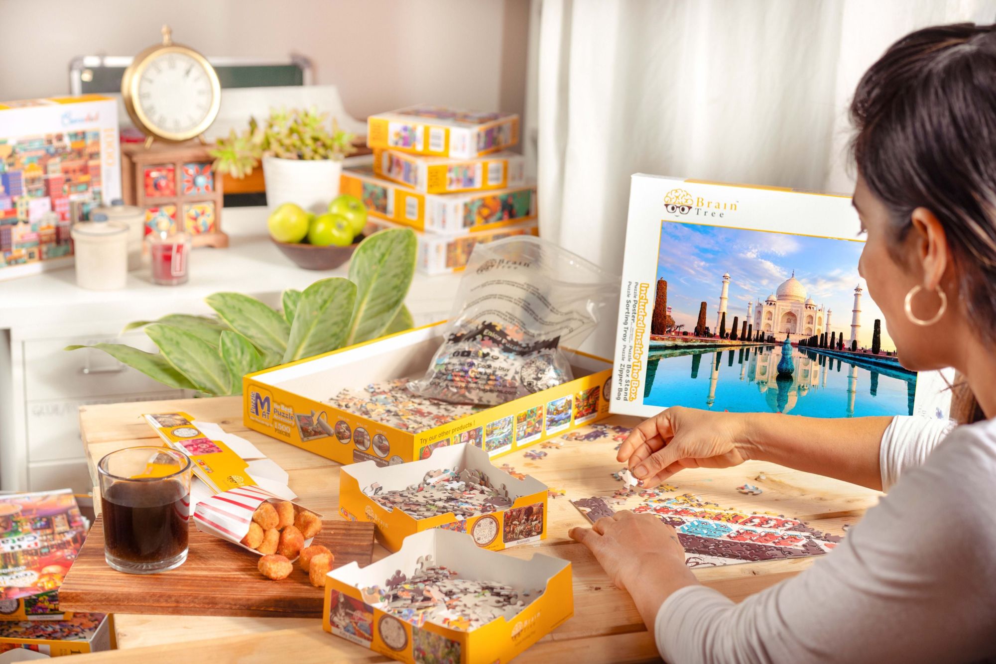 A Taj Mahal Jigsaw Puzzles 1000 Piece featuring an image of the Taj Mahal with reflections in water, labeled "1000 pieces" and branded by Brain Tree.